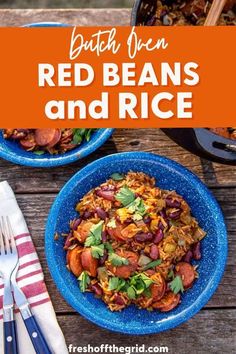 red beans and rice in blue bowls on a wooden table with silver utensils