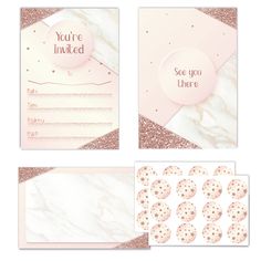 the pink and gold wedding stationery is set up with matching envelopes, cards, and