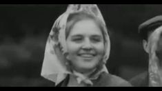 black and white photo of two people wearing headscarves