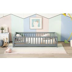 a baby's room with pastel walls and furniture