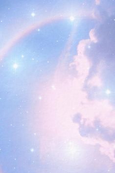 a rainbow in the sky with clouds and stars