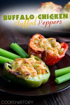 two black plates topped with stuffed peppers and celery