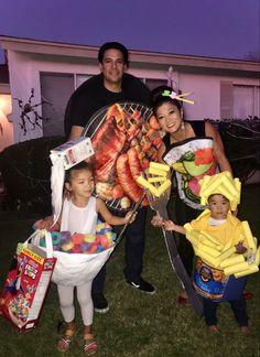 three people and two children are dressed up in costumes that look like they have food on them