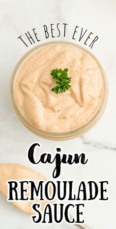 the best ever cajun remoulade sauce in a glass bowl with parsley on top