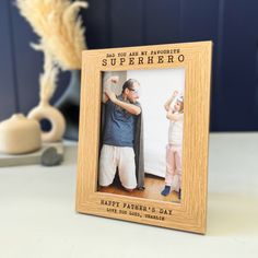 a father's day photo frame with an image of his son and daughter on it