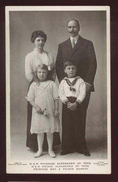 an old black and white photo of a family posing for a portrait in the early 1900's