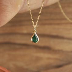 Handcrafted Pear Cut Emerald Pendant Necklace - Minimalist Lab Grown Gemstone Jewelry. Elegant Minimalist Lab Grown Emerald Pendant Necklace - Pear Cut Gemstone Jewelry Gemstone ✦ 𝗟𝗮𝗯 𝗚𝗿𝗼𝘄𝗻 / 𝗖𝗿𝗲𝗮𝘁𝗲𝗱 𝗘𝗺𝗲𝗿𝗮𝗹𝗱 - 𝗠𝗮𝗻 - 𝗠𝗮𝗱𝗲 ✦ Pear Cut -  ✦ Color -Green ✦ Excellent / Very Good Cut - Size (mm) : 3/4 mm (approx) ✦ Setting :  Bezel ✦ Bail -  3 mm Diameter Inside ✦ READY TO SHIP - GIFTS ✦ ( ONLY CHARM - PENDANT - SELECT CHAIN as per order ) Metal  ✦ Made of recycled 𝗦𝗼𝗹𝗶𝗱 𝗚𝗼𝗹𝗱 - Nickel free - 14k (585) ✦ Color - Yellow Gold - (as per order)  ✦ Weight-  0.400 Grams (Gold weight will vary as per order / Metal purity) ✦ Condition ➠ Brand New, Never been Used ✦ Send a message for Ring in Platinum Pt950 / ✦ Ring Available in Platinum Pt950 ✦ Stamp/Hallmark: Yes Con Emerald Necklace In Yellow Gold For Weddings, Yellow Gold Emerald Necklace For Wedding, Wedding Emerald Necklace In Yellow Gold, Teardrop Emerald Gemstone Necklace For Wedding, Teardrop Emerald Necklace For Wedding, Teardrop Emerald Wedding Necklace, Wedding Teardrop Emerald Necklace, Sterling Silver Emerald Necklace For Weddings In May, Sterling Silver Emerald Necklace For Wedding, May Birthstone