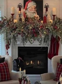 a living room decorated for christmas with stockings and candles on the fireplace mantels