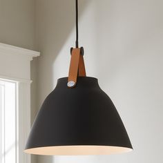 a black and brown light hanging from a ceiling