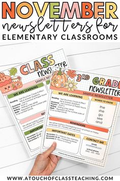 a hand holding two elementary classroom posters with the text november