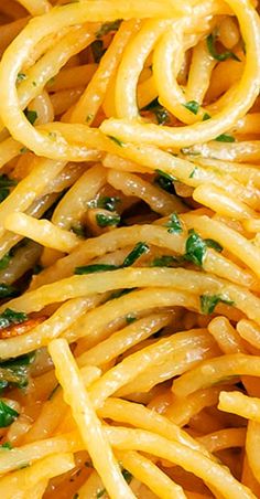 pasta with mushrooms and spinach is shown in a dish that looks like it has been cooked