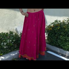 Designer. Unique Skirt For Women Of Today Add Class And Elegance. Stand Out In This Pink/Orange Long Skirt, Gold Details Overall, Pure Cotton Fabric For That Breathable Comfort . Wear It With Crop Tops, Bodysuits And Go On A New Adventure ! It Will Never Go Out Of Style. Size Fits Small To Large With The Tie String ! Traditional Summer Flowy Maxi Skirt, Belly Dance Maxi Skirt For Festival, Traditional Summer Skirt, Festive Skirt With Traditional Drape, Bollywood Style Summer Festive Skirt, Summer Festive Bollywood Skirt, Traditional Long Skirt For Summer, Traditional Long Summer Skirt, Bohemian Long Skirt For Festival