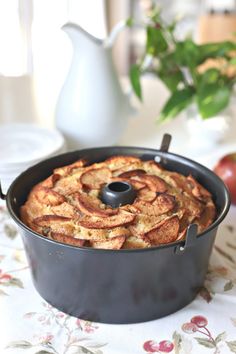 an apple cake in a pan on a table