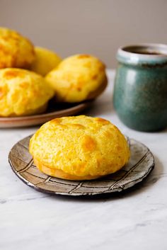 two plates with muffins on them sitting on a table