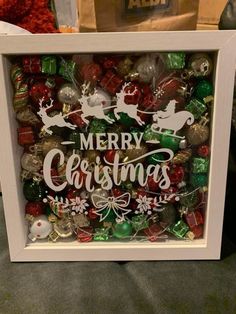 a framed christmas ornament with santa's sleigh