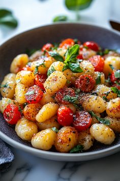 Gnocchi with cherry tomatoes, fresh basil, and black pepper in a bowl. Homemade Gnocchi Recipes, Gnocchi Meals