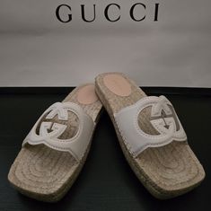 Gucci Interlocking G Cut-Out Espadrilles Highlights Cream White - Calf Leather Signature Interlocking G Logo Cut-Out Detailing " Open Toe Slip-On Style Braided Raffia Sole Composition Lining: Calf Leather 100%, Jute 100% Outer: Leather 100% Sole: Rubber 100% Brand New Gucci Open Toe Espadrilles For Vacation, Gucci Casual Espadrilles For Vacation, Casual Gucci Espadrilles For Vacation, Gucci Sandals With Woven Sole For Summer, Casual Gucci Espadrilles With Round Toe, Designer Flat Heel Espadrilles For Beach, Casual Gucci Espadrilles, Gucci Espadrilles For Beach With Branded Insole, Designer White Espadrilles With Round Toe