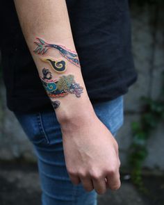 a person with a tattoo on their arm