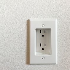 a white electrical outlet on the wall