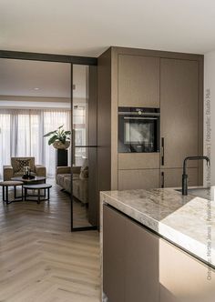 the kitchen is clean and ready to be used as a living room or dining area