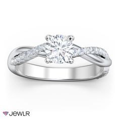 a white gold engagement ring with diamonds on it