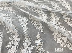 High quality embroidery lace This fabric is perfect  for Wedding  Bridal Dress,Evening gown,Cocktail dress and some others.  It is very gorgeous high quality fabric. ★Materials * High quality Bridal Embroidery lace * Primary fabric: Tulle * Secondary fabric: Embroidery lace * Color: Off White   ★MEASUREMENTS * Price is set for 1 yard(=91.44cm).   You will receive the fabric in one continuous piece if you purchase more than 1 yard. * Width : Mesh : 60~61 inch (152~154cm)               Embroidered Elegant Embroidered White Tulle Fabric, Elegant White Embroidered Tulle Fabric, Elegant White Embroidered Fabric With Scalloped Lace, Elegant Lace Embroidered Fabric For Wedding, Elegant White Tulle Fabric For Ceremony, Elegant Embroidered Fabric With Scalloped Lace For Wedding, Elegant White Tulle Fabric With Floral Embroidery, Elegant Off White Embroidered Fabric For Wedding, Elegant Crochet Lace Tulle Fabric For Wedding