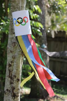 an olympic ribbon hanging from a tree