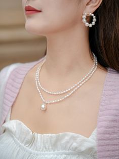 Introducing the "COCOKIM Embellished Series Double-Layer Pearl Necklace," a must-have accessory for pearl lovers. This necklace embodies princess elegance with its graceful double-layer design and sweet sophistication.Whether you're dressing up for a special occasion or adding a touch of elegance to your everyday look！ Metal: 14K Gold Filled Gemstone: Freshwater Pearl Small Pearl Dimensions: 60*40mm Large Pendant Pearls Dimensions: 180*150mm (including metal parts) Inner Chain Length: 380mm Oute Elegant Pearl Bridal Necklace With Clavicle Chain, Elegant Double Strand Pearl Pendant Jewelry, Elegant Double Strand Necklace For Weddings, Elegant Double Strand Necklace With Pearl Charm, Elegant Double Strand Pearl Necklace With Clavicle Chain, Elegant Double Strand Clavicle Pearl Necklace, Elegant Double Strand Pearl Chain Necklace, Elegant Double Strand Pearl Drop Jewelry, Elegant Double Strand Pearl Necklace With Pendant