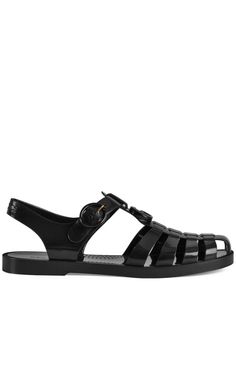 Sandals designed by the fashion house Gucci. Luxurious sandals made of rubber with a glossy finish and decorated with the famous Gucci logo on the front and on the back strap. The sandals have a buckle closure for full adjustment to the dimensions of your foot and maximum comfort.Open toe Buckle closure100% rubber upper 100% rubber sole Made in Italy Luxury Women's T-strap Sandals With Buckle, Luxury Black Gucci Men's Shoes, Luxury Open Toe T-strap Sandals With Rubber Sole, Designer Black T-strap Sandals Luxury, Luxury Open Toe Sandals With Rubber Sole, Luxury Open Toe Sandals With Logo, Luxury Designer Sandals With Rubber Sole, Designer Luxury Black T-strap Sandals, Luxury Adjustable Straps Open Toe Sandals