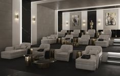 a room filled with lots of white chairs and gold tables next to each other on top of black carpeted flooring