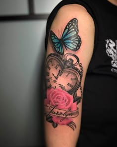 a woman with a tattoo on her arm has a clock and a rose in the shape of a heart