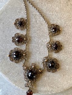 Beautiful Art Nouveau Austro Hungarian Garnet Filigree Sterling Silver Gold Ball Accent Vintage Antique Bib Festoon Necklace Measures aprox 16 inches around Victorian Silver Necklace With Historical Design, Victorian Filigree Metal Necklaces, Victorian Filigree Metal Necklace, Antique Silver Necklace With Historical Design, Ornate Silver Baroque Necklaces, Antique Necklace With Historical Design For Formal Occasions, Antique Necklace With Historical Design For Formal Events, Victorian Necklace With Historical Design For Formal Occasions, Ornate Historical Design Necklaces For Formal Occasions