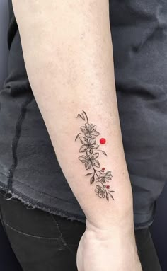 a person with a flower tattoo on their arm