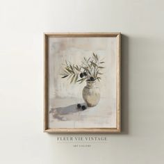 a painting hanging on the wall with an olive tree in a vase and two black berries