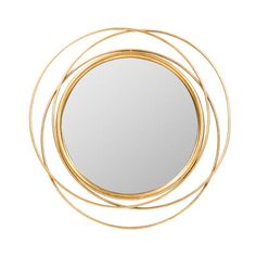 a round mirror sitting on top of a white wall