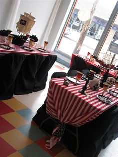 tables set up with red and white striped tablecloths