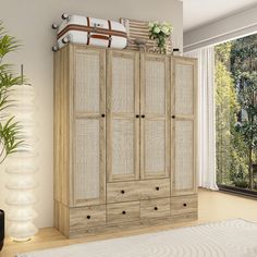 a large wooden cabinet sitting next to a window in a room with a rug on the floor