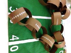 some paper chains that are on top of a football field