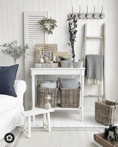 a living room filled with furniture and baskets