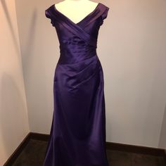 a purple dress on display in a room