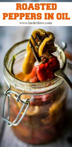 a jar filled with pickled peppers in oil