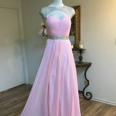 Nwt Poly U.S.A." Formal, Evening, Maxi, Long Dress Sleeveless. ** Halter Neck ** Embellished In Silver Rhinestones On The Top Front & Back ** Cut Out Front & Back **Double Lined. **Zipr Closure Color: Pink. Size: M Measure Proximity: ** Bust: 36' In. **Waist: 28' In. **Hip: 44" In. **Length: 60" In. Silver Sleeveless Prom Dress, Sleeveless Rhinestone Dress For Prom, Sleeveless Rhinestone Dress For Prom Season, Silver Sleeveless Dress For Prom, Silver Sleeveless Dress For Prom Season, Elegant Pink Sleeveless Dress For Homecoming, Elegant Pink Sleeveless Homecoming Dress, Crystal Embellished Evening Dress For Homecoming, Sleeveless Homecoming Dresses With Rhinestones