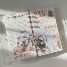 an open planner book with pictures and words on the pages that are attached to it