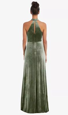 a woman in a green dress looking back