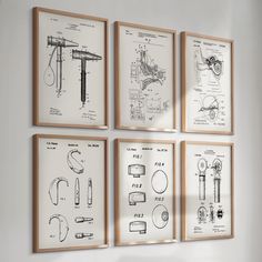 four framed drawings are hanging on the wall