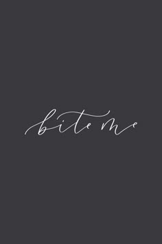 the word bitten written in cursive writing on a black background with white ink