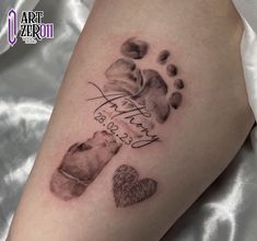 a woman's leg with an inked paw print and two hearts on it