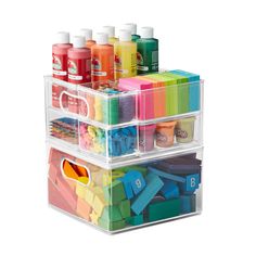 three bins with different types of crafting supplies in each container and one is filled with markers