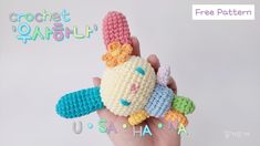 a crocheted stuffed animal in the palm of someone's hand