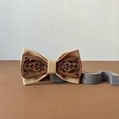 Camel wooden bow tie and pocket square set Groomsmen gifts Elegant wedding bow ties for men  The bow tie is packaged in a wonderful kraft box with a beautiful bow. You will have a perfect and unique gift! The bow tie is handmade and created with huge love! Colors will suit costumes and everyday outfits. Size Adult bow tie 4,5x2,5 inch (11,5x6,5 cm) Neck 14 - 20,5 inch (35,5 - 52 cm ) The size of the neck is adjustable Size pocket square 10 x 10 inch (25 x 25cm) Classic Brown Suit And Tie Accessories As Gift, Father's Day Gift Bow Tie And Suit Accessories, Brown Satin Bow Tie For Wedding, Dapper Brown Bow Tie For Wedding, Brown Bow Tie For Father's Day Gift, Brown Bow Tie For Wedding, Brown Bow Tie For Wedding And Father's Day, Father's Day Brown Formal Bow Tie, Dapper Bow Tie With Decorative Bow For Gifts